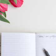 open book with a pen on a desk
